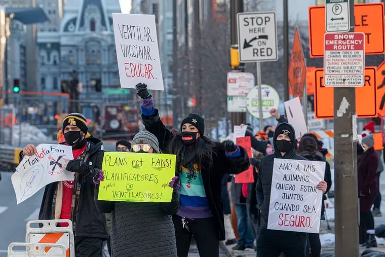 Teachers and supporters gather to protest during a rally outside the Philadelphia School District headquarters in Philadelphia, Pa. Monday February 8, 2021.