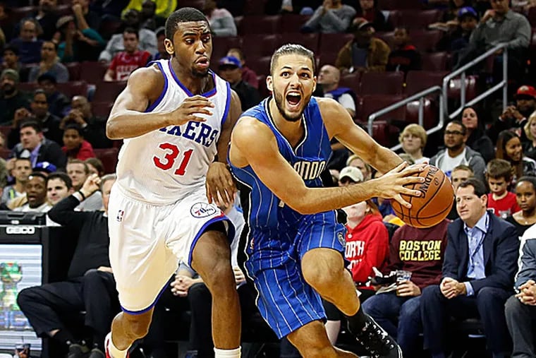 Magic guard Evan Fournier drives to the basket past 76ers guard Hollis Thompson during the second quarter. (Bill Streicher/USA Today Sports)