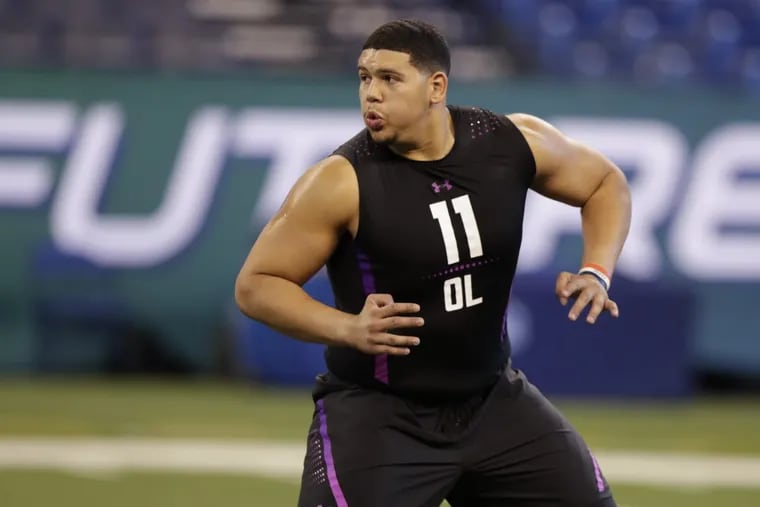 Maine offensive lineman Jamil Demby runs a drill at the NFL football scouting combine in Indianapolis on Friday.