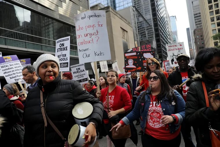 Striking Chicago public school teachers and supporters rally in front of CPS headquarters in downtown Chicago on Oct. 17.