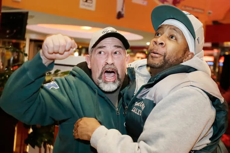 Fans, at Phily Diner Sports Bar in Runnemede, N.J., celebrate the Eagles' victory over the Bears on Jan. 6, 2019.
