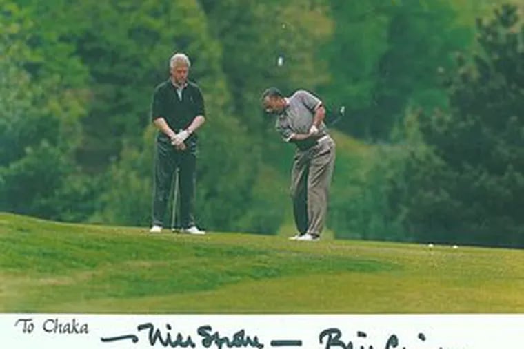 An autographed photo shows Rep. Chaka Fattah golfing with then-President Bill Clinton in Virginia in 1997. Fattah says he hasn&#0039;t played at all this year and only about 10 times last year.