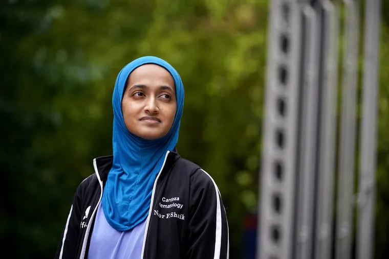 Noor Shaik, a fourth-year medical student at Thomas Jefferson University, stands for a portrait at the school's campus in Center City. Shaik, who has extended family living in India, organized the shipment of thousands of pieces of personal protective equipment donated from local medical centers to Bangalore.
