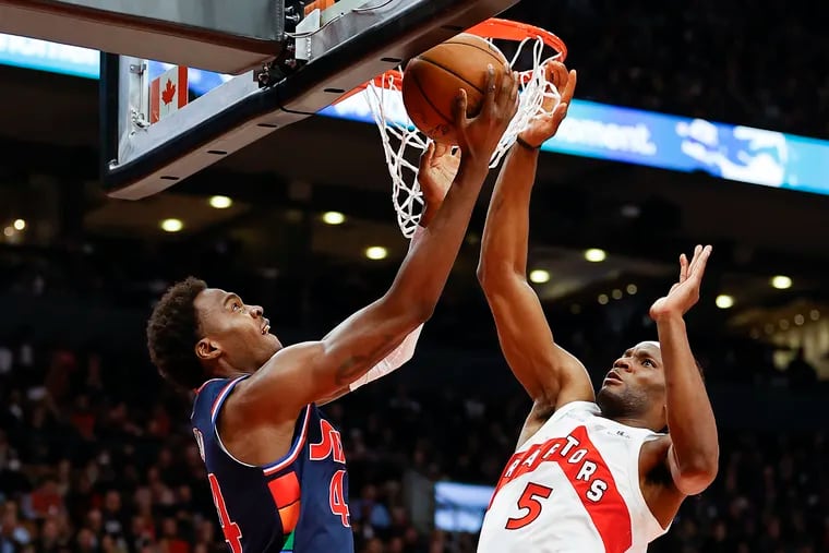 Sixers forward Paul Reed drives to the basket against Toronto Raptors forward Precious Achiuwa during game three of the first-round Eastern Conference playoffs on Wednesday, April 20, 2022 in Toronto.