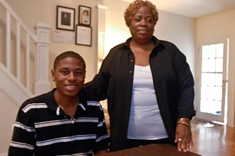 Stefan Johnson, the first African-American student body president of
Roman Catholic High School, and his mother Monica Johnson in their
South Philly home. (Ron Tarver / Staff Photographer)