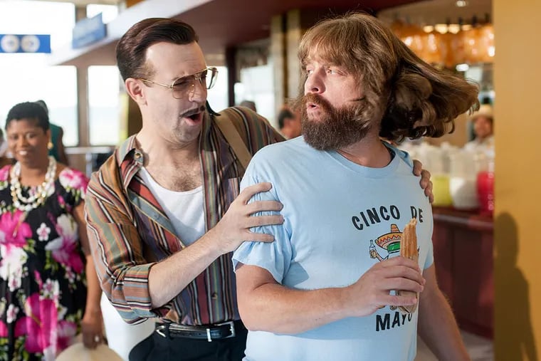 Jason Sudeikis (left) is an assassin, Zach Galifianakis the hapless heister in the rom-com &quot;Masterminds,&quot; based on real life.
