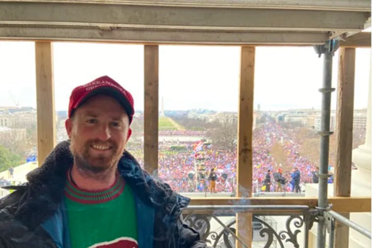 Patrick Stedman poses for a selfie on the balcony in the office suite of the speaker of the U.S. House during the Jan. 6, 2021, attack on the U.S. Capitol.