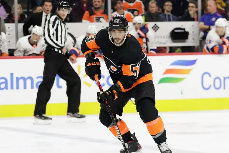 Flyers defenseman Shayne Gostisbehere skates with the puck against the New York Islanders on Nov. 16. He is battling for a lineup spot and played well Tuesday.