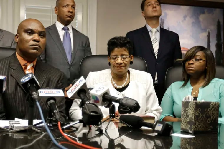 Sandra Bland's mother , Geneva Reed-Veal (center), and sister Sierra Cole hold a news conference in Houston with lawyer Cannon Lambert (left). &quot;She never should have been inside the jail cell,&quot; Reed-Veal said. AP