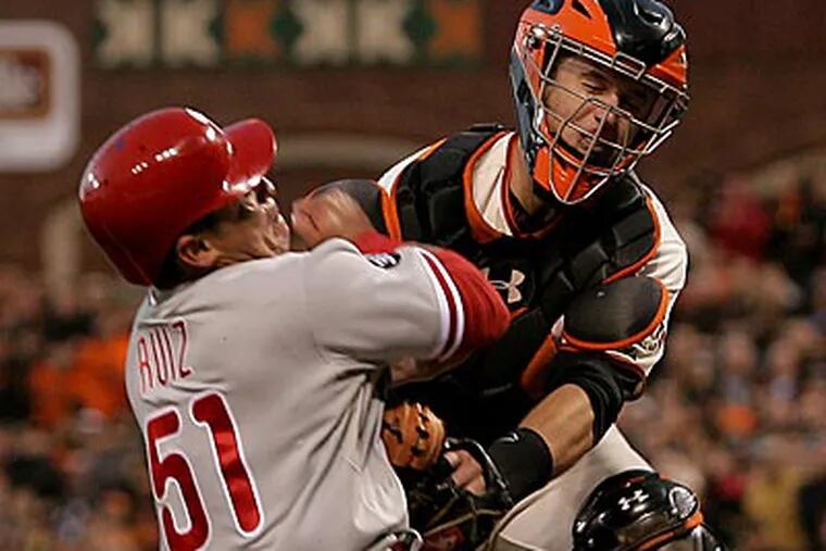 Giants catcher Buster Posey tags out Phillies catcher Carlos Ruiz at home in the fifth inning. (Yong Kim/Staff Photographer)