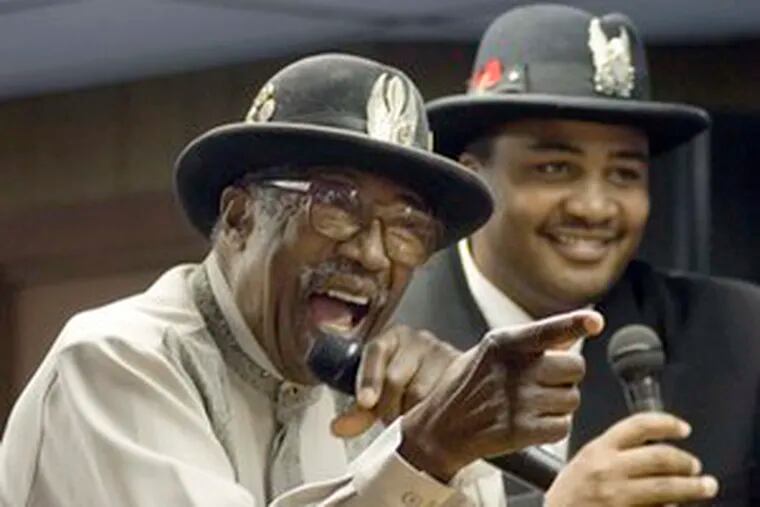 Diddley (left) and grandson Gary Mitchell sing a rap song during Bo Diddley Day on Feb. 25, 2006, in Archer, Fla., where Diddley lived. He had been recuperating there since a stroke in August.