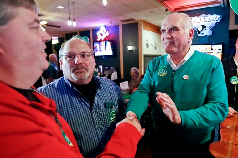 U.S. Rep. Mike Kelly (right) greets supporters at his election returns party last year, in Butler, Pa. He was one of the chief co-sponsors of the SECURE Act.