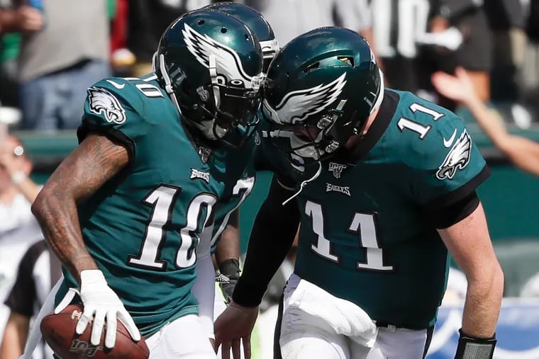 Eagles wide receiver DeSean Jackson and quarterback Carson Wentz celebrate after a touchdown in the second half of the game against Washington on Sunday, September 8, 2019 in Philadelphia.
