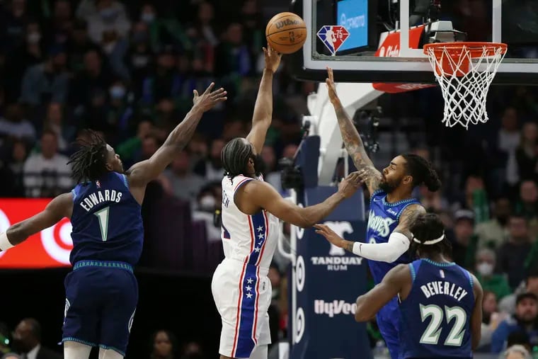 Philadelphia 76ers guard James Harden (1) shoots against Minnesota Timberwolves guard D'Angelo Russell (0) during the first half of their game Friday, Feb. 25, 2022, in Minneapolis.