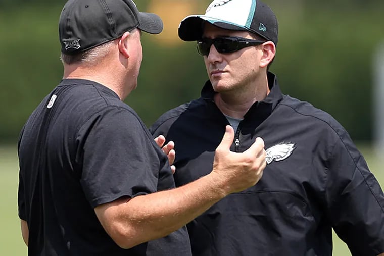 Eagles head coach Chip Kelly (left) and general manager Howie Roseman (right). (David Maialetti/Staff file photo)