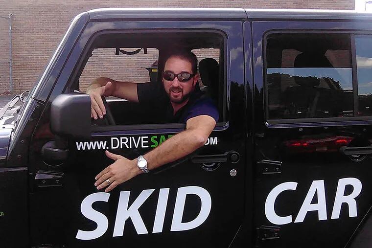 Drew Groelinger demonstrates the Skid Car, a specially designed 2014 Jeep Wrangler, during a defensive training class for driver education instructors in Maple Shade.
