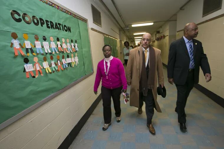 Pennsylvania state Sen. Vincent Hughes (center) tours Locke Elementary at 4550 Haverford Ave., Philadelphia on Friday morning, Jan. 29, 2016. He is looking into conditions of Philadelphia public school buildings. Also shown are principal Katherine Carter, (left) and Jerry Jordan, president of the Philadelphia Federation of Teachers.