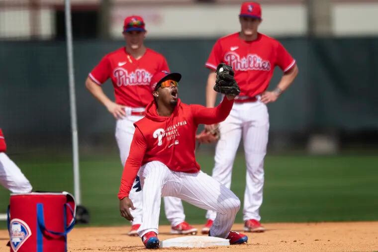 Phillies second baseman Jean Segura secures a ball in his glove during a spring-training workout last week in Clearwater, Fla.