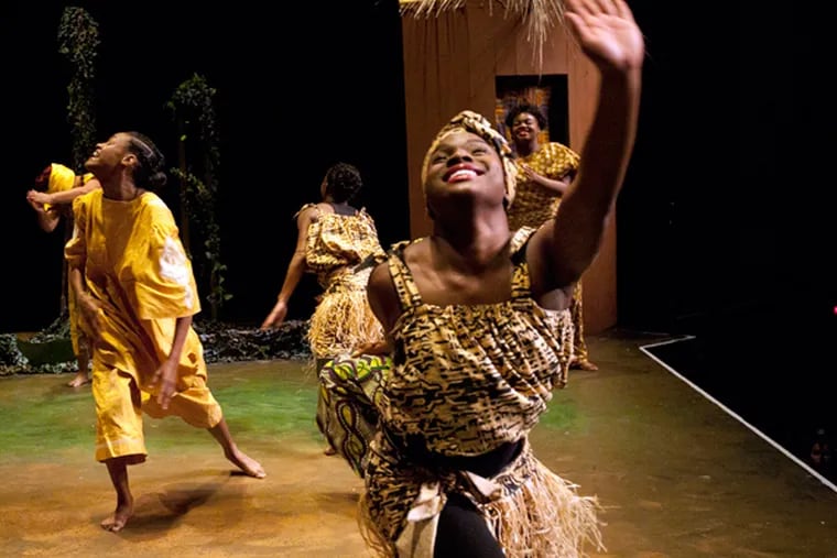 Camden's Universal African Dance and Drum Ensemble of Unity Community Center and the Camden Repertory Theater collaborate to put on an original African musical, Mufaro's Beautiful Daughters at Rutgers' Gordon Theater on Dec. 12,  2013. Here, Maia Kelly-Miller on stage. (APRIL SAUL/Staff)