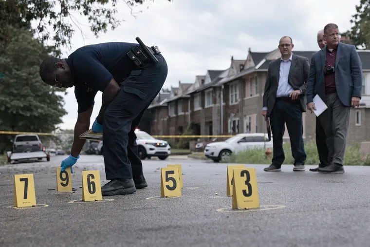 Philadelphia Police process the scene of a shooting on Aug. 21, when a 26-year-old woman was killed in a drive-by shooting. City Controller Rebecca Rhynhart said in a report released Tuesday that the Kenney administration has not spent enough city funding to combat violence in the short term.