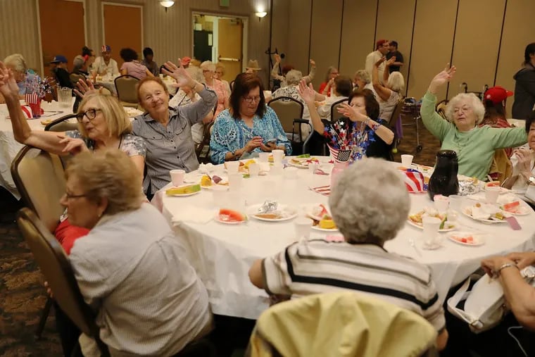 Seniors singing during the lunch program at the Katz Jewish Community Center in Cherry Hill, N.J.