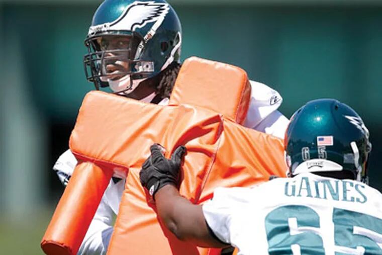 Defensive tackle Jervonte Jackson works with fellow undrafted rookie Josh Gaines at an Eagles minicamp in May.     (David Maialetti / Staff Photographer)