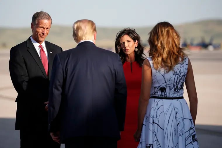 Sen. John Thune, R-S.D., and Gov. Kristi Noem greet President Donald Trump and first Lady Melania Trump upon arrival at Ellsworth Air Force Base,  in Rapid City, S.D.