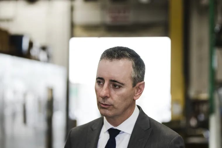 Rep. Brian Fitzpatrick (R.,Pa.) listens during a campaign event at the Load Rite Trailers manufacturing facility in Fairless Hills, on Sept. 17.