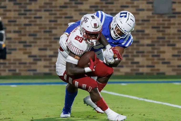 Temple's Edward Saydee (23) is tackled in the backfield by Duke's DeWayne Carter, right, during the first half of an NCAA college football game in Durham, N.C., Friday, Sept. 2, 2022. (AP Photo/Ben McKeown)