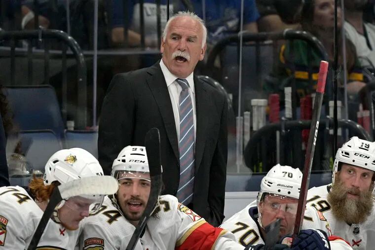 Florida Panthers coach Joel Quenneville calls out instructions during the third period of the team's preseason NHL hockey game against the Tampa Bay Lightning, Thursday, Oct. 7, 2021, in Tampa, Fla. (AP Photo/Phelan M. Ebenhack)