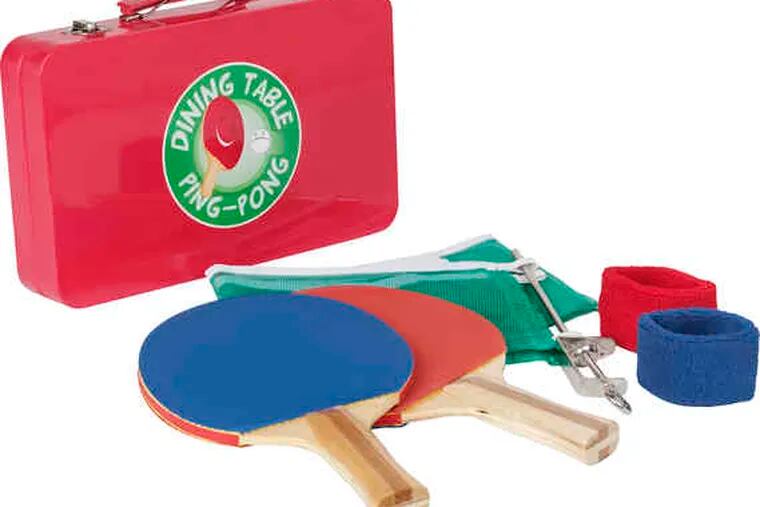 Leave Guitar Hero to the kids. Dad knows the real fun is in Dining Table Ping Pong ($29.95), a kit that includes everything he needs for a rousing match. Available at paper-source.com.