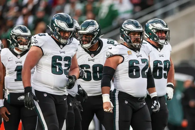 Eagles center Jason Kelce (62) leads the offensive line onto the field against the New York Jets on Oct. 15.