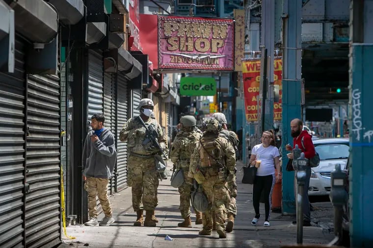 Pennsylvania National Guard walking along Kensington Ave in Philadelphia on Thursday, June 4, 2020. The Guard was in Philadelphia during several days of protests and looting around the city.