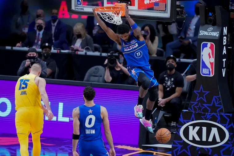 Brooklyn Nets guard Kyrie Irving dunks during the second half of the NBA All-Star Game in Atlanta.