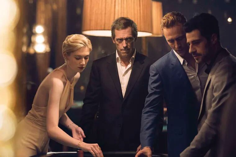 AMC's six-part John le Carré adaptation, "The Night Manager," includes (from left) Elizabeth Debick as Jed Marshall, Hugh Laurie as charming villain Richard Onslow Roper, and Tom Hiddleston as British soldier-turned-hotelier Jonathan Pine.