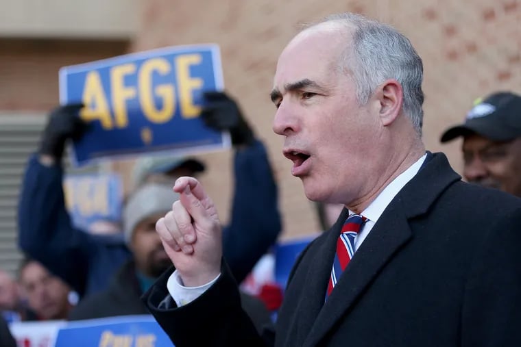 Sen. Bob Casey (D-Pa.) speaks during a rally against the government shutdown outside Philadelphia International Airport in Philadelphia on Friday, Jan. 25, 2019. Local members of Congress and furloughed government employees called for an end to the shutdown as workers missed another paycheck Friday.