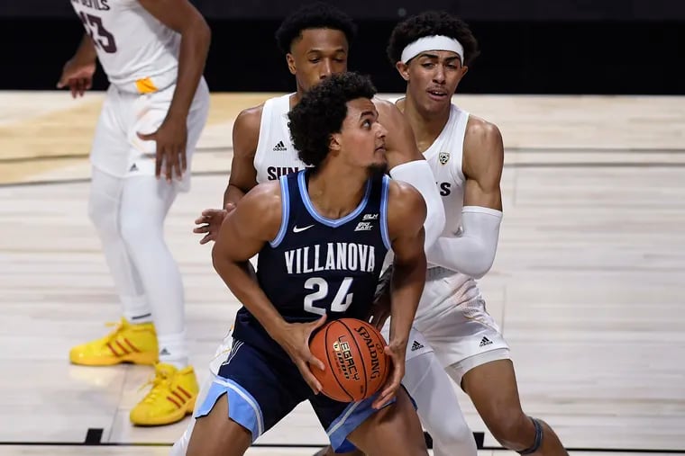 Villanova's Jeremiah Robinson-Earl (front) looks to shoot as Arizona State's Marcus Bagley (back left) and Jalen Graham  defend on Thursday.