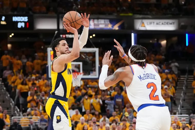 Tyrese Haliburton #0 of the Indiana Pacers attempts a shot while being guarded by Miles McBride #2 of the New York Knicks in the fourth quarter at Gainbridge Fieldhouse on May 17, 2024 in Indianapolis, Indiana. (Photo by Dylan Buell/Getty Images)