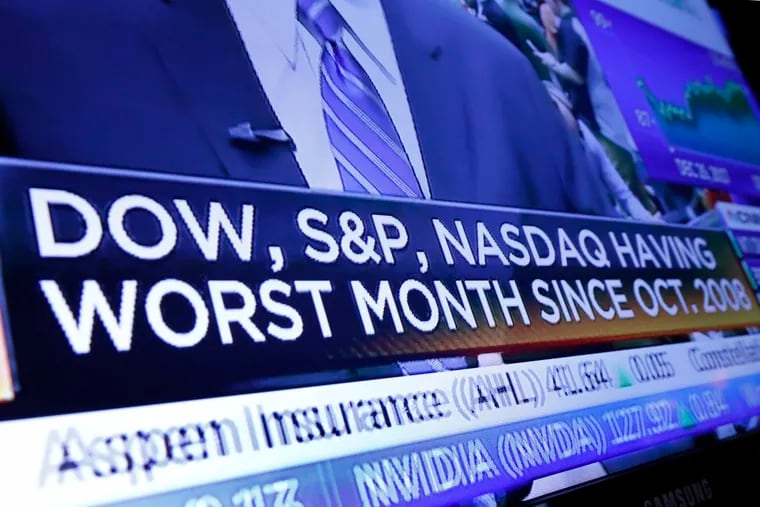 A headline appears on a television screen on the floor of the New York Stock Exchange, Wednesday, Dec. 26, 2018. Stocks are opening strongly higher on Wall Street Wednesday, with real estate, raw materials and energy stocks leading a broad rebound from Monday's steep losses. (AP Photo/Richard Drew)