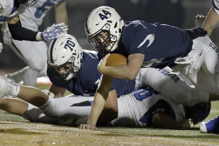 Shawnee's  Colin Wetterau dives into the end zone to put his team ahead 13-0 against Hammonton.