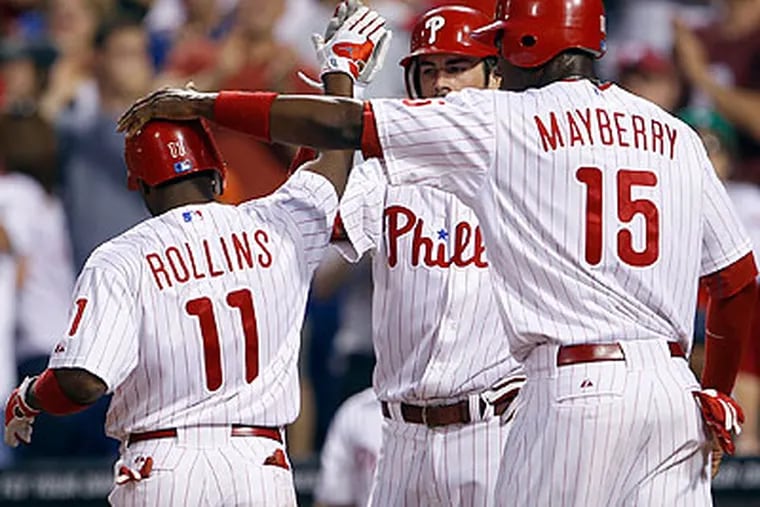 Jimmy Rollins and John Mayberry Jr. helped the Phillies score seven runs in the third inning last night. (Yong Kim/Staff Photographer)