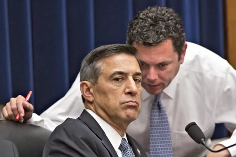 House Oversight Committee Chairman Rep. Darrell Issa, R-Calif., left, confers with Rep. Jason Chaffetz, R-Utah, right, at a House Oversight Committee hearing about last year's deadly assault on the U.S. diplomatic mission in Benghazi, Libya, on Capitol Hill in Washington, Wednesday, May 8, 2013. (AP Photo/J. Scott Applewhite)
