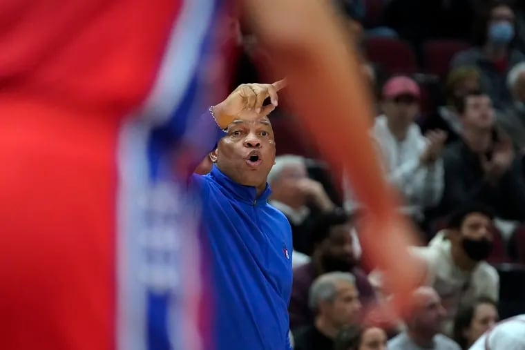 Philadelphia 76ers coach Doc Rivers gestures to players during the second half of the team's 114-105 win over the Chicago Bulls in Chicago. It was Rivers' 1,000th career coaching victory.