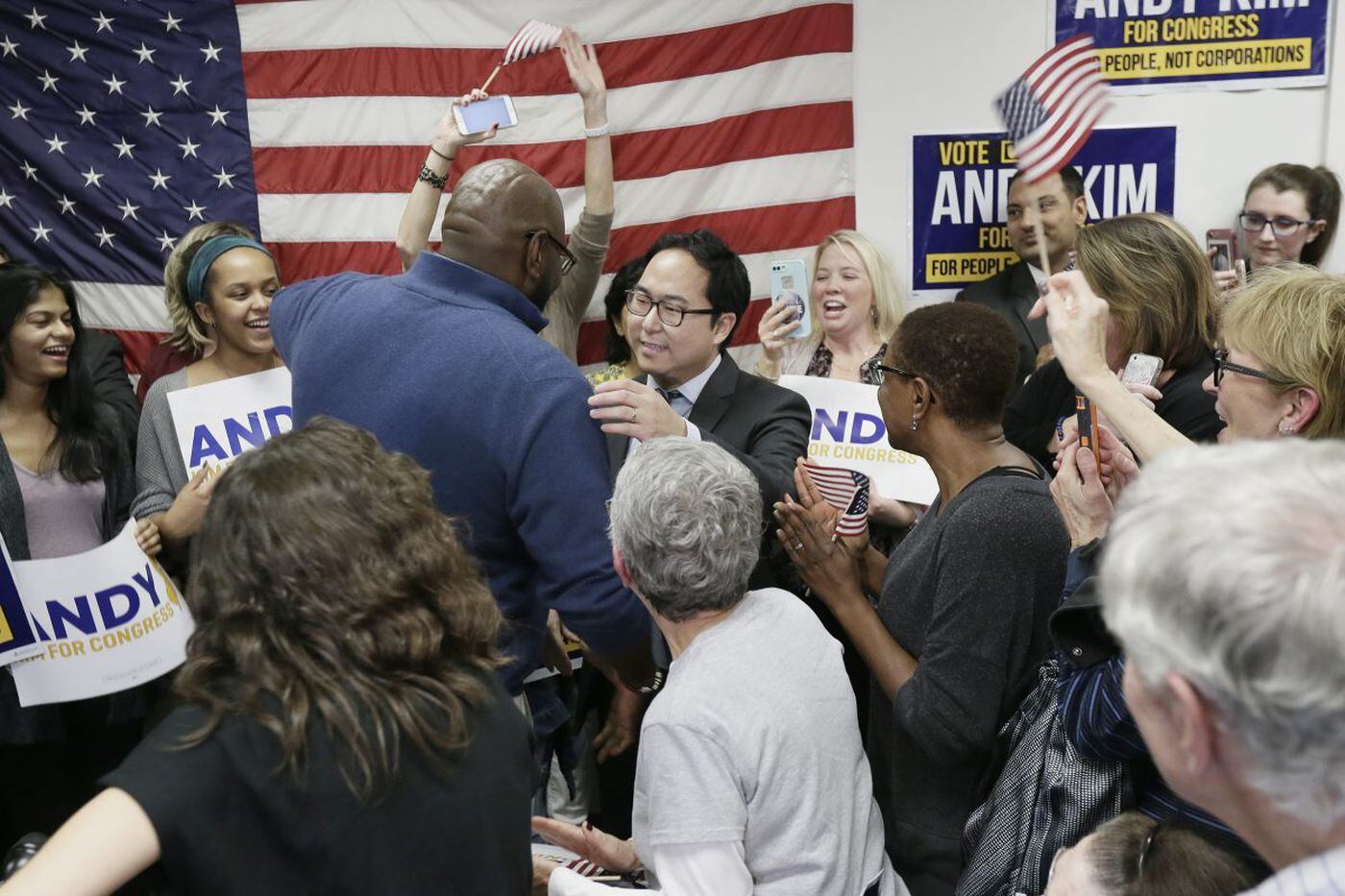 Democrat Andy Kim hugs NJ Senator Troy Singleton before announcing that he is the projected winner of the NJ 3rd District Congressional race. The announcement was before a packed crowd at his Mt. Laurel headquarters on Nov. 7, 2018.