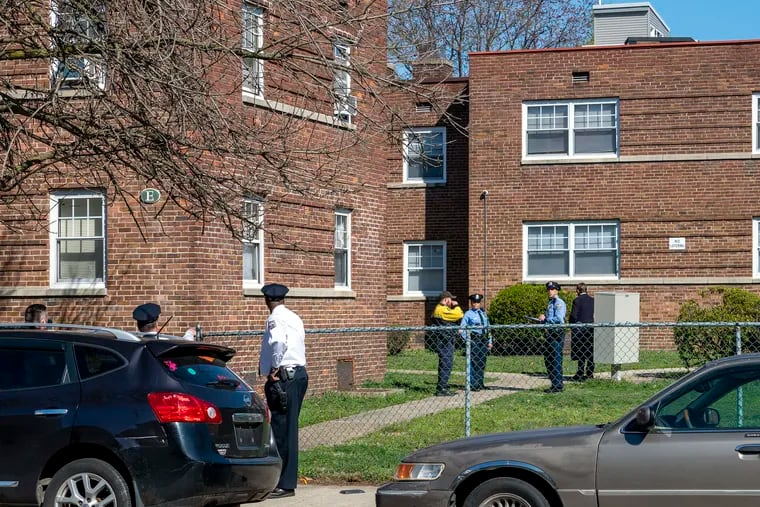 The scene at the Girard Court Apartments in the city’s Sharswood section on Wednesday after a deputy landlord-tenant officer shot a woman in the head while trying to enforce an eviction.