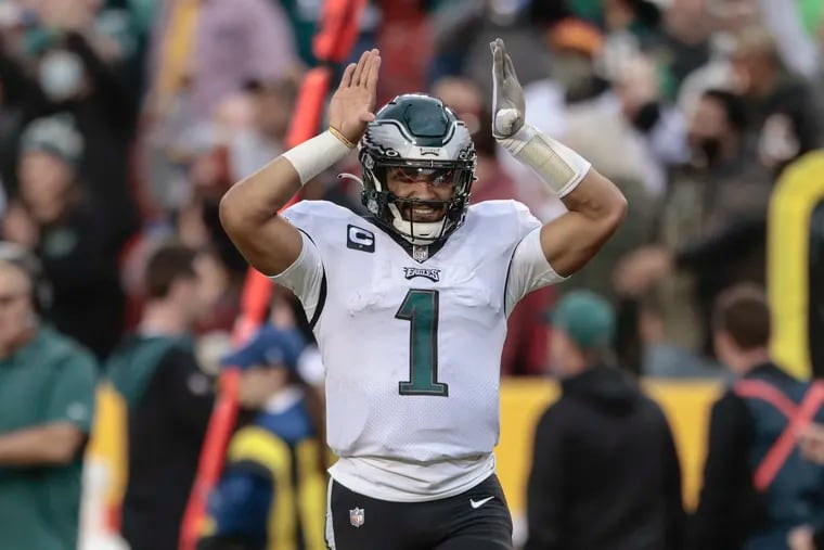 Philadelphia Eagles quarterback Jalen Hurts (1) flashes the Omega Psi Phi before the last play of the game against Washington at FedEx Field in North Englewood, MD, Sunday, January 2, 2022. Eagles beat Washington 20-16.