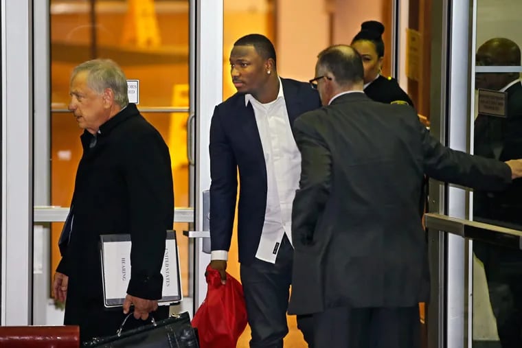 Former Eagle running back LeSean McCoy leaves with his attorney, Dennis Cogan, left, after meeting with representatives of the District Attorney's Office and Philadelphia police.