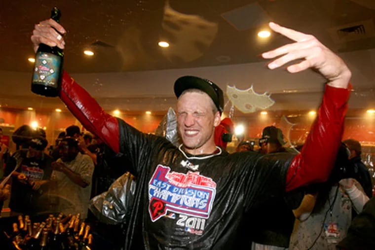 Hunter Pence takes part in the locker-room celebration after the Phillies clinched the NL East. (Charles Fox / Staff Photographer)