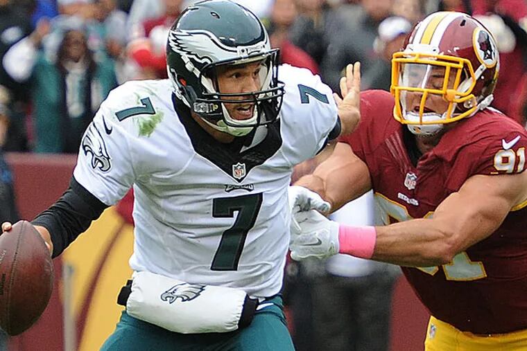 Eagles quarterback Sam Bradford eludes the sack by Washington linebacker Ryan Kerrigan.
