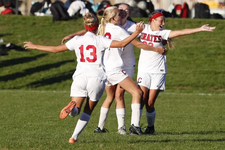 Hailey Gutowski, left, of Cinnaminson is swarmed by teammates after she scored against Moorestown in the 2nd half of a girls' soccer game on Oct. 11, 2016. The goal gave Cinnaminson a 3-1 lead and trailing much of the game. Cinnaminson won 4-1. CHARLES FOX / Staff Photographer